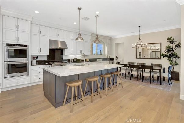 Chandelier, Dining room, Interior, Kitchen, Pendant Lights, Recessed Lighting, Stainless Steel Appliances, Wood Texture Flooring