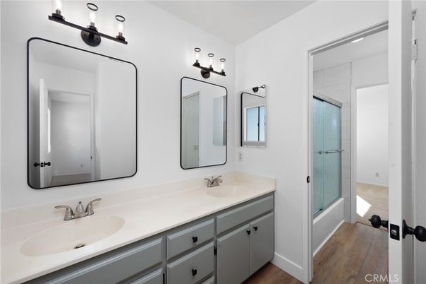 Bathroom, Dual Sink Vanities, Glass Shower, Interior, Wood Texture Flooring