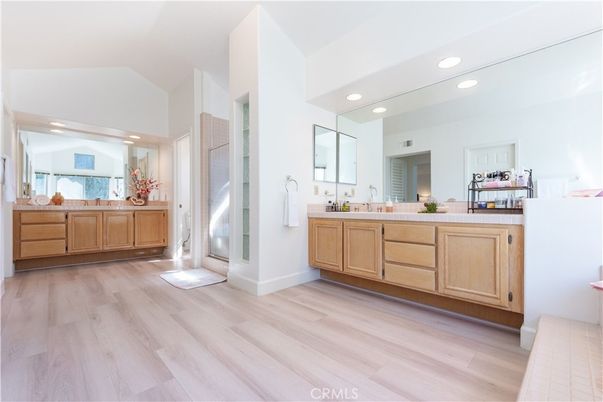 Bathroom, Dual Sink Vanities, Interior, Recessed Lighting, Wood Texture Flooring