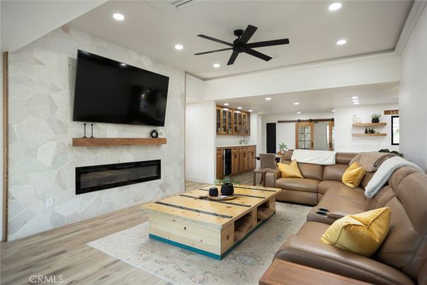 Fireplace, Interior, Living room, Recessed Lighting, Stone Walls, Wood Texture Flooring