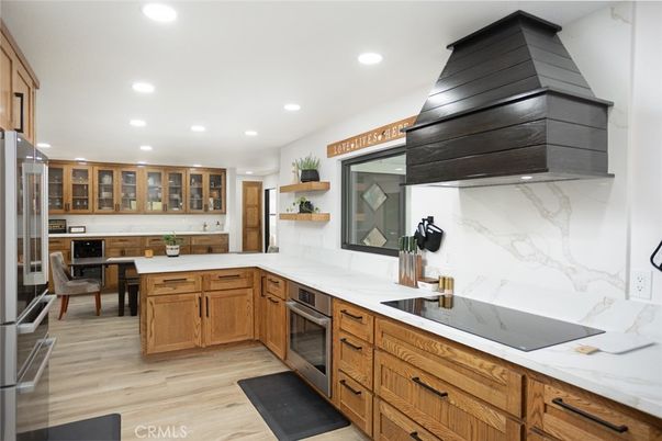 Interior, Kitchen, Marble Walls, Recessed Lighting, Stainless Steel Appliances, Wood Texture Flooring