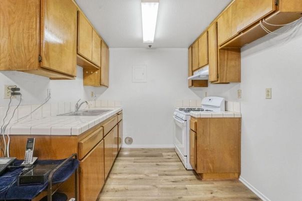 Interior, Kitchen, Tile Countertops, Wood Texture Flooring