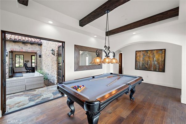 Billiard Table, Chandelier, Game Room, Interior, Pendant Lights, Recessed Lighting, Stone Walls, Wooden Beams, Wood Texture Flooring