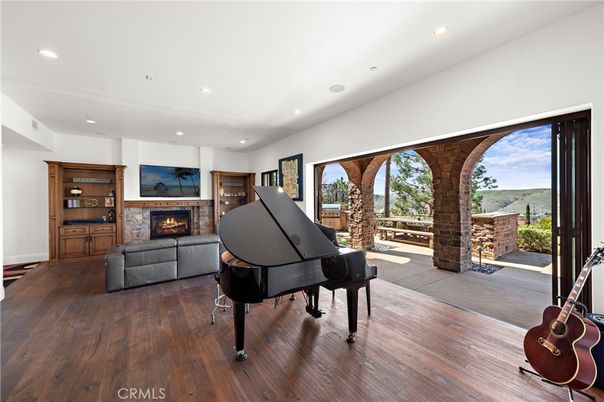 Fireplace, Interior, Piano, Recessed Lighting, Wood Texture Flooring