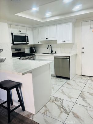 Interior, Kitchen, Marble, Marble Walls, Recessed Lighting, Stainless Steel Appliances
