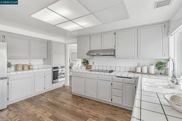 Interior, Kitchen, Tile Countertops, Wood Texture Flooring