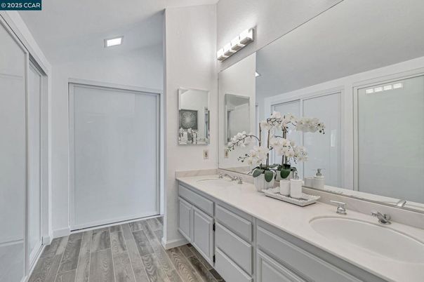 Bathroom, Dual Sink Vanities, Interior, Recessed Lighting, Wood Texture Flooring