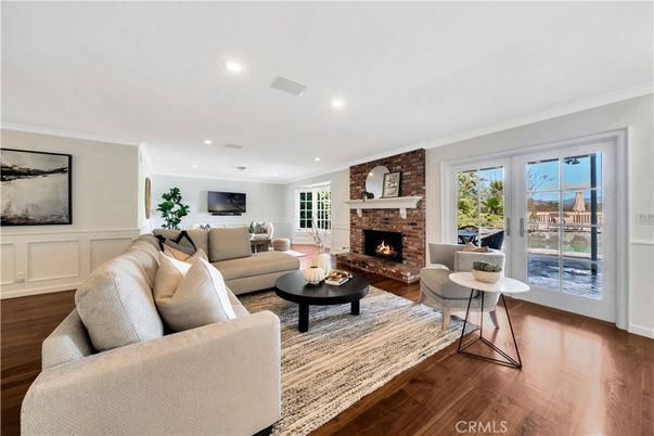 Fireplace, Interior, Living room, Recessed Lighting, Stone Walls, Wood Texture Flooring