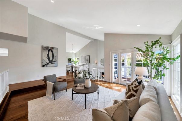 Chandelier, Dining room, Fireplace, Interior, Living room, Pendant Lights, Recessed Lighting, Wood Texture Flooring