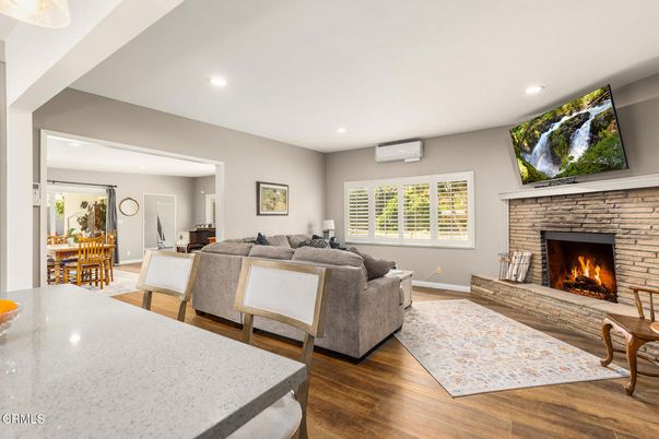 Dining room, Fireplace, Interior, Living room, Recessed Lighting, Wood Texture Flooring