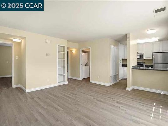 Empty room, Interior, Kitchen, Stainless Steel Appliances, Wood Texture Flooring