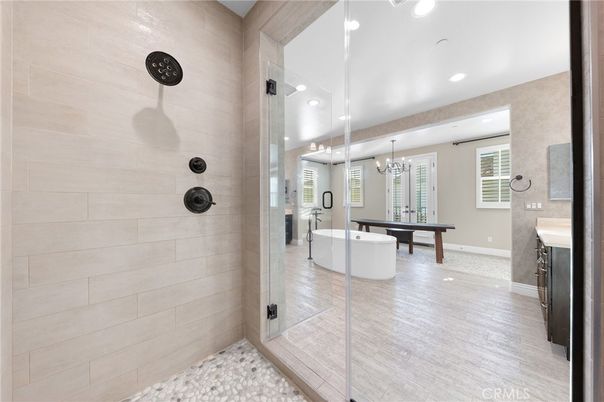 Bathroom, Chandelier, Free Standing Baths, Game Room, Interior, Pendant Lights, Recessed Lighting, Wood Texture Flooring