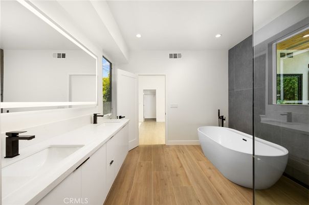 Bathroom, Dual Sink Vanities, Free Standing Baths, Interior, Recessed Lighting, Wood Texture Flooring