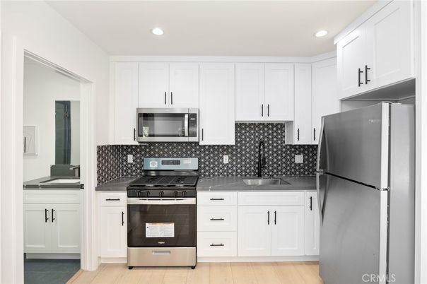 Interior, Kitchen, Recessed Lighting, Stainless Steel Appliances, Wood Texture Flooring