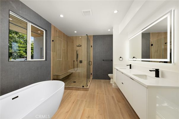 Bathroom, Dual Sink Vanities, Free Standing Baths, Glass Shower, Interior, Recessed Lighting, Wood Texture Flooring