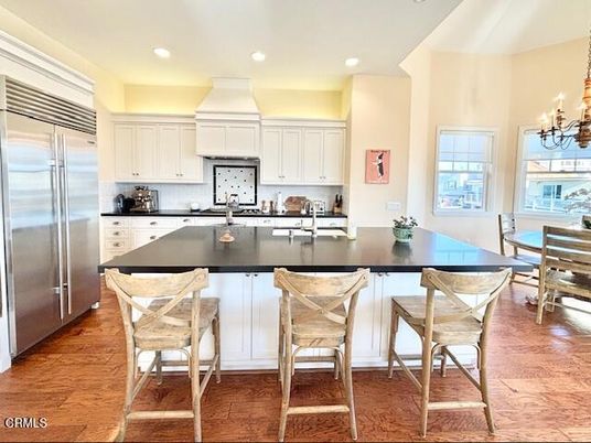 Chandelier, Dining room, Interior, Kitchen, Recessed Lighting, Stainless Steel Appliances, Wood Texture Flooring