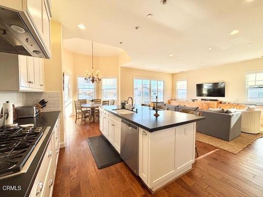 Chandelier, Dining room, Interior, Kitchen, Living room, Recessed Lighting, Stainless Steel Appliances, Wood Texture Flooring