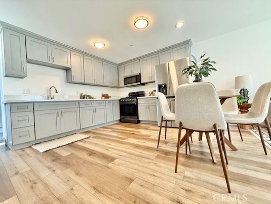 Dining room, Interior, Kitchen, Recessed Lighting, Stainless Steel Appliances, Wood Texture Flooring