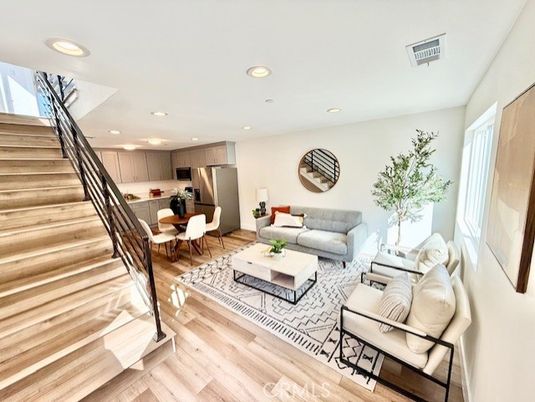 Dining room, Interior, Kitchen, Living room, Recessed Lighting, Stainless Steel Appliances, Wood Texture Flooring