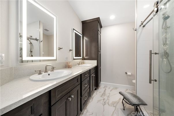 Bathroom, Dual Sink Vanities, Glass Shower, Interior, Marble, Recessed Lighting
