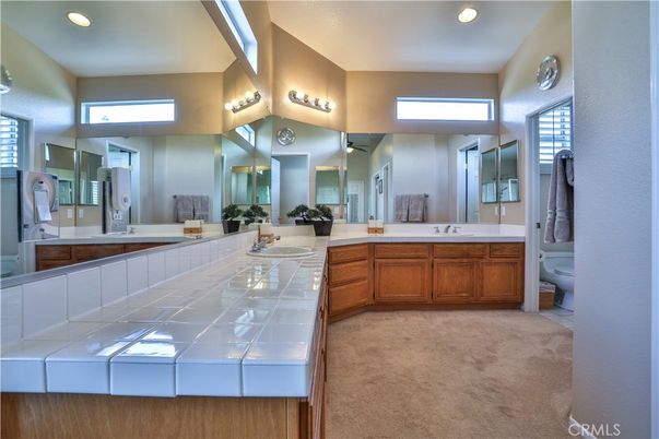 Bathroom, Dual Sink Vanities, Interior, Recessed Lighting, Tile Countertops