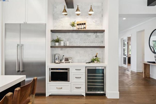 Interior, Kitchen, Marble Walls, Recessed Lighting, Stainless Steel Appliances, Wood Texture Flooring