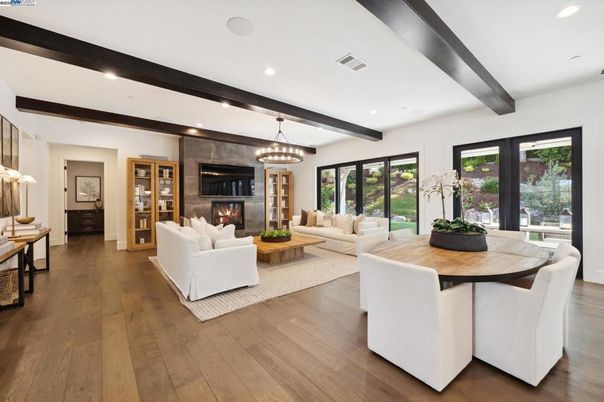 Dining room, Fireplace, Interior, Living room, Pendant Lights, Recessed Lighting, Wooden Beams, Wood Texture Flooring