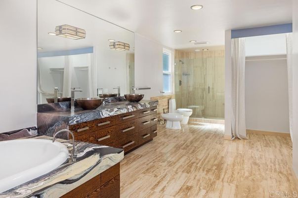 Bathroom, Dual Sink Vanities, Glass Shower, Interior, Recessed Lighting, Wood Texture Flooring