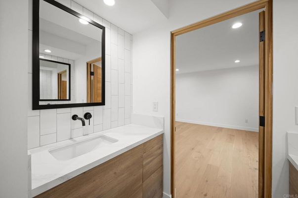 Bathroom, Dual Sink Vanities, Interior, Recessed Lighting, Wood Texture Flooring