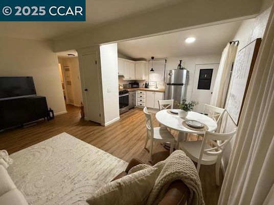 Dining room, Interior, Kitchen, Living room, Recessed Lighting, Stainless Steel Appliances, Wood Texture Flooring