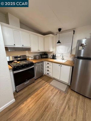 Interior, Kitchen, Pendant Lights, Stainless Steel Appliances, Wood Texture Flooring