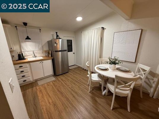 Dining room, Interior, Kitchen, Pendant Lights, Recessed Lighting, Stainless Steel Appliances, Wood Texture Flooring