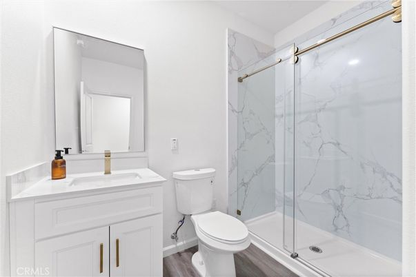 Bathroom, Glass Shower, Interior, Marble Walls, Wood Texture Flooring