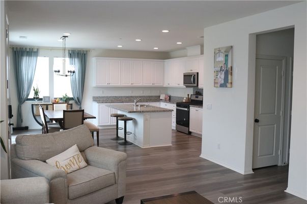 Dining room, Interior, Kitchen, Living room, Pendant Lights, Recessed Lighting, Stainless Steel Appliances, Wood Texture Flooring