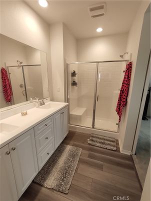 Bathroom, Dual Sink Vanities, Glass Shower, Interior, Recessed Lighting, Wood Texture Flooring