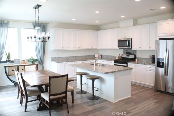 Dining room, Interior, Kitchen, Pendant Lights, Recessed Lighting, Stainless Steel Appliances, Wood Texture Flooring