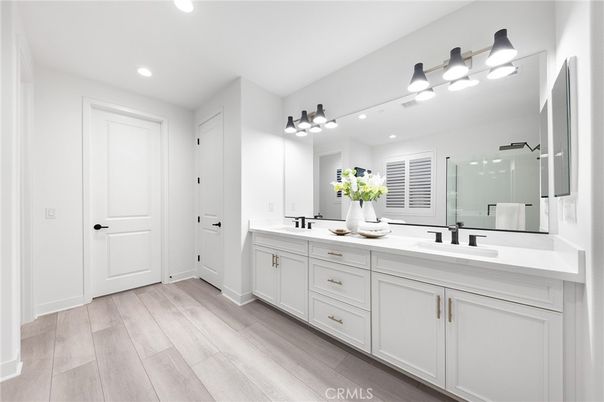 Bathroom, Dual Sink Vanities, Glass Shower, Interior, Recessed Lighting, Wood Texture Flooring