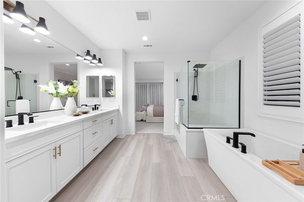 Bathroom, Dual Sink Vanities, Free Standing Baths, Glass Shower, Interior, Recessed Lighting, Wood Texture Flooring
