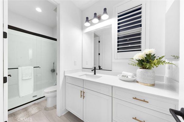 Bathroom, Dual Sink Vanities, Glass Shower, Interior, Recessed Lighting, Wood Texture Flooring
