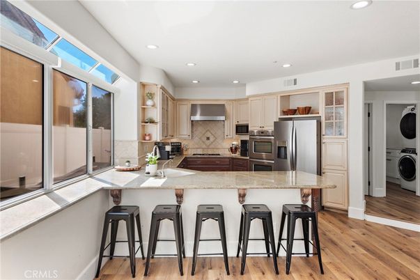 Interior, Kitchen, Recessed Lighting, Stainless Steel Appliances, Washer, Wood Texture Flooring