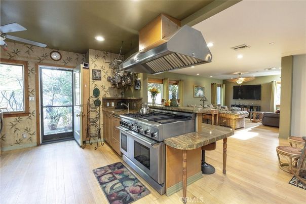 Dining room, Interior, Kitchen, Living room, Recessed Lighting, Stainless Steel Appliances, Wood Texture Flooring