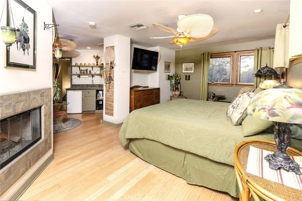 Bedroom, Fireplace, Interior, Recessed Lighting, Wood Texture Flooring