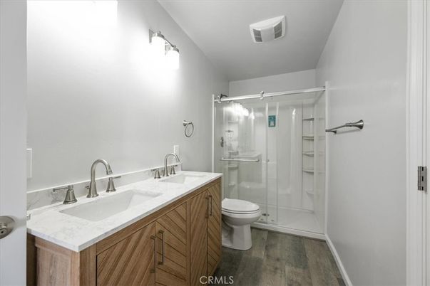 Bathroom, Dual Sink Vanities, Glass Shower, Interior, Wood Texture Flooring