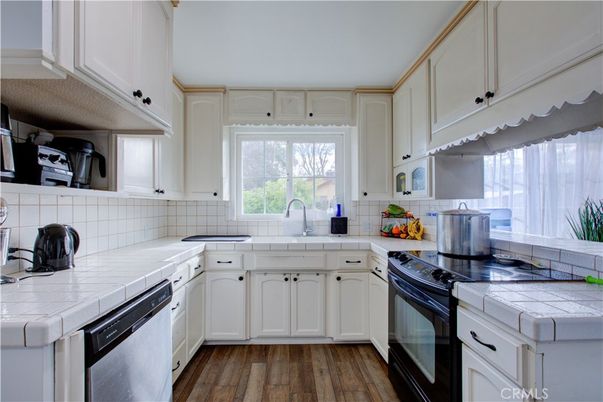 Interior, Kitchen, Tile Countertops, Wood Texture Flooring