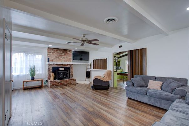 Fireplace, Interior, Living room, Recessed Lighting, Stone Walls, Wood Texture Flooring