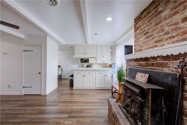 Fireplace, Interior, Kitchen, Recessed Lighting, Stone Walls, Wood Texture Flooring