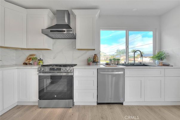 Interior, Kitchen, Marble Walls, Stainless Steel Appliances, Wood Texture Flooring