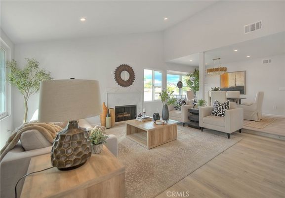 Chandelier, Dining room, Fireplace, Interior, Living room, Pendant Lights, Recessed Lighting, Wood Texture Flooring