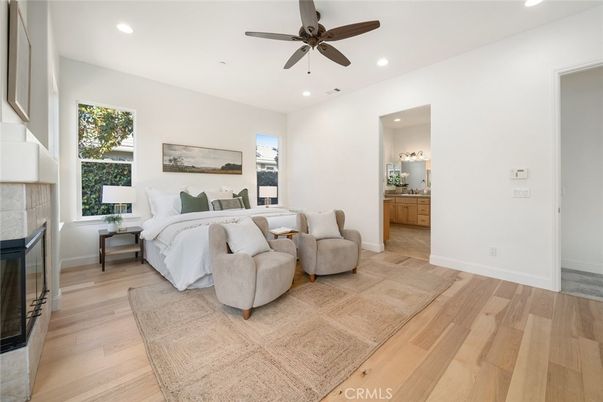 Bedroom, Fireplace, Interior, Recessed Lighting, Wood Texture Flooring