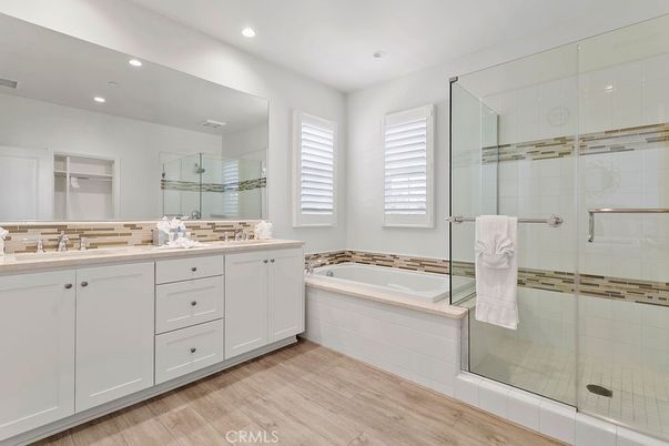 Bathroom, Dual Sink Vanities, Glass Shower, Interior, Recessed Lighting, Wood Texture Flooring